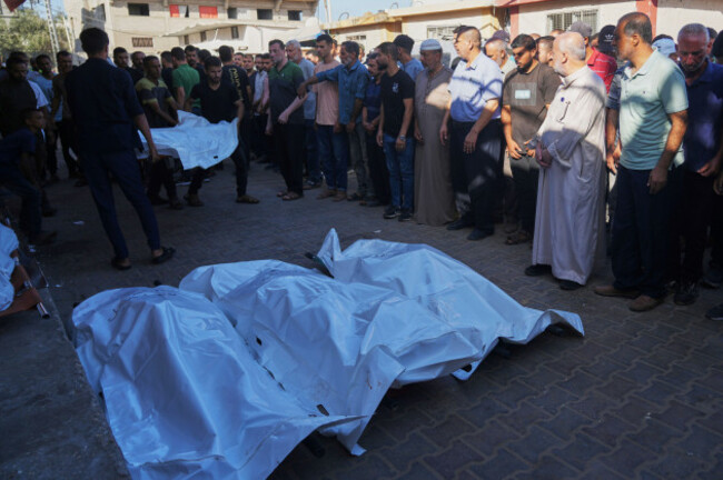 palestinians-carry-the-body-of-a-family-member-killed-in-an-israeli-military-strike-as-they-gather-outside-al-aqsa-hospital-in-deir-al-balah-in-the-central-gaza-strip-monday-sept-1-2025-ap-phot