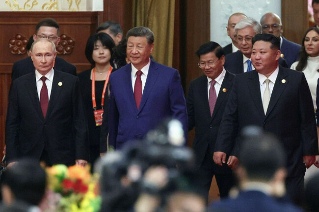 from-left-russian-president-vladimir-putin-chinese-president-xi-jinping-and-north-korean-leader-kim-jong-un-arrive-at-a-reception-following-a-military-parade-to-commemorate-the-80th-anniversary-of-t