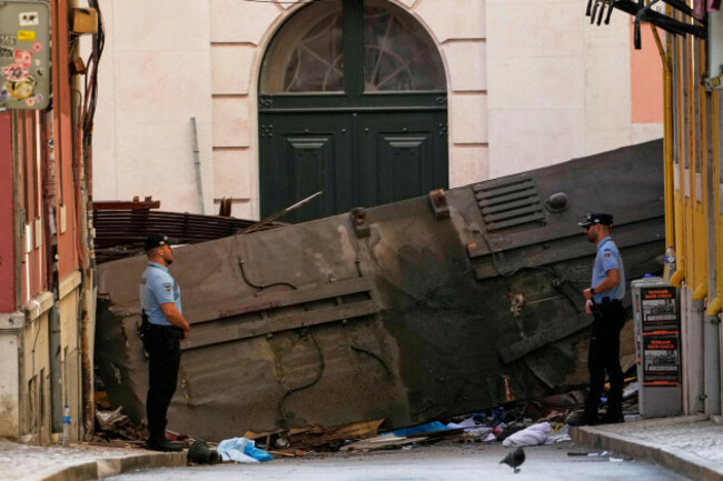 police-officers-cordon-off-the-area-where-a-tourist-streetcar-derailed-and-crashed-in-lisbon-portugal-thursday-sept-4-2025-ap-photoarmando-franca