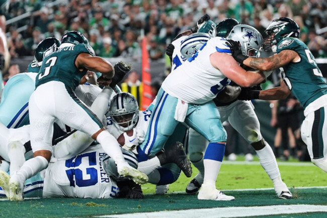 dallas-cowboys-running-back-javonte-williams-center-bottom-lands-in-the-end-zone-for-a-touchdown-in-the-first-half-of-an-nfl-football-game-against-the-philadelphia-eagles-thursday-sept-4-2025-in
