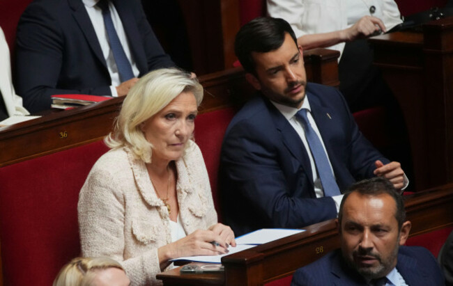 french-far-right-leader-marine-le-pen-listens-to-the-speech-of-french-prime-minister-francois-bayrou-at-the-national-assembly-prior-to-a-parliamentary-confidence-vote-that-could-bring-him-down-in-pa