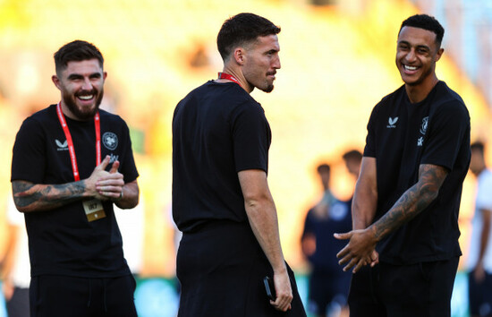 ryan-manning-matt-doherty-and-adam-idah-share-a-joke-before-the-game