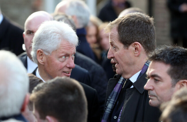 former-us-president-bill-clinton-speaks-with-alastair-campbell-after-the-funeral-of-northern-irelands-former-deputy-first-minister-and-ex-ira-commander-martin-mcguinness-at-st-columbas-church-long-t