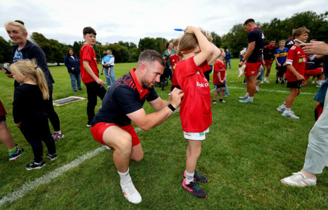 jj-hanrahan-signs-a-young-fans-shirt