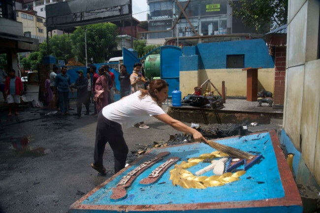 a-volunteer-cleans-a-police-station-which-was-vandalized-during-anti-corruption-protests-sparked-by-a-short-lived-social-media-ban-in-kathmandu-nepal-saturday-sept-13-2025-ap-photoniranjan-shr