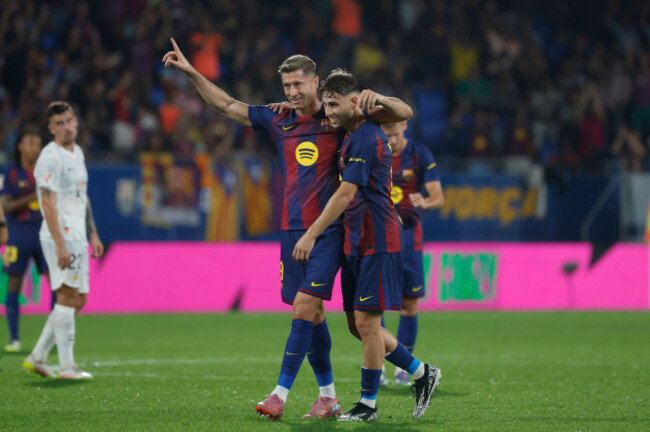 barcelonas-robert-lewandowski-left-celebrates-after-the-var-confirmed-his-sides-6th-goal-with-marc-casado-during-a-spanish-la-liga-soccer-match-between-fc-barcelona-and-valencia-at-the-johan-cruyf