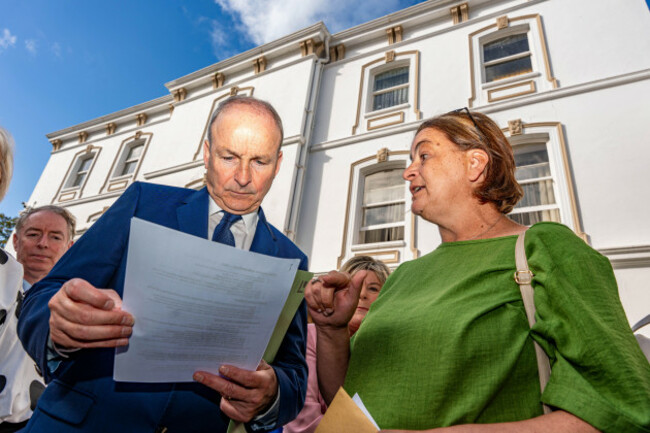 antoinette-burke-right-mother-of-katie-burke-from-cobh-confronts-taoiseach-micheal-martin-left-alongside-fianna-fail-td-mary-butler-centre-outside-the-fianna-fails-parliamentary-party-annual