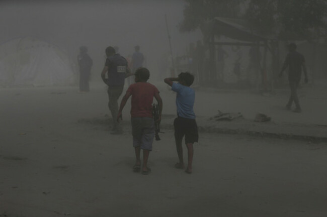 palestinians-walk-through-dust-moments-after-an-israeli-military-strike-and-destroyed-a-building-in-gaza-city-monday-sept-15-2025-ap-photoyousef-al-zanoun