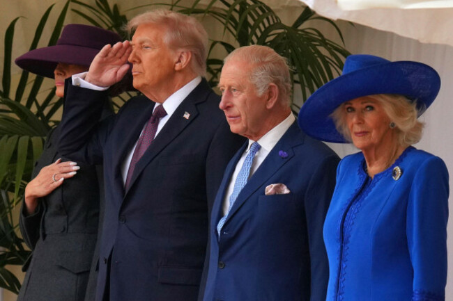 president-donald-trump-salutes-standing-beside-britains-king-charles-iii-and-queen-camilla-with-melania-trump-on-the-left-as-they-listen-to-the-national-anthem-at-windsor-castle-in-windsor-england