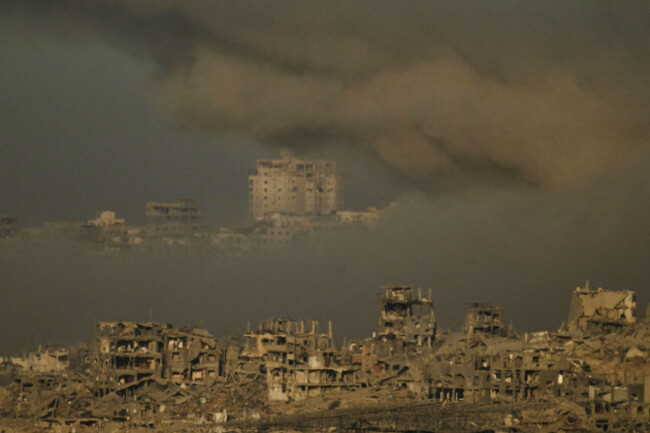 buildings-that-were-destroyed-during-the-israeli-ground-and-air-operations-are-engulfed-by-smoke-following-an-israeli-military-strike-in-the-northern-gaza-strip-as-seen-from-southern-israel-saturday