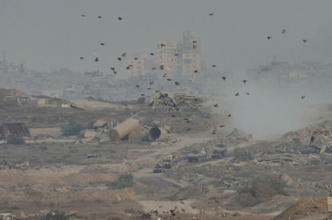 israeli-soldiers-drive-on-their-armored-personnel-carrier-inside-the-northern-gaza-strip-as-seen-from-southern-israel-sunday-sept-21-2025-ap-photoohad-zwigenberg