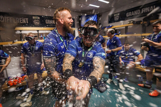 rg-snyman-celebrates-with-andrew-porter-with-champagne-in-the-dressing-room-after-the-game