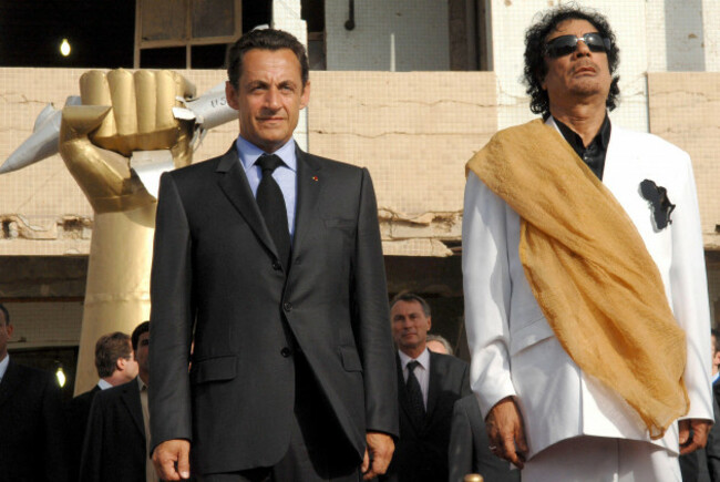 file-photo-dated-july-25-2007-of-libyas-president-moammar-gadhafi-and-his-counterpart-from-france-nicolas-sarkozy-listen-to-national-anthems-at-bab-azizia-palace-in-tripoli-libya-french-prosecutor