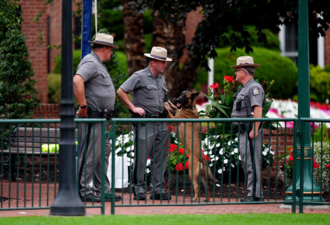 a-general-view-of-police-officers-on-patrol-with-a-dog-at-the-bethpage-black-course-farmingdale-new-york-ahead-of-the-45th-ryder-cup-which-starts-tomorrow-ryder-cup-organisers-are-stepping-up-secur