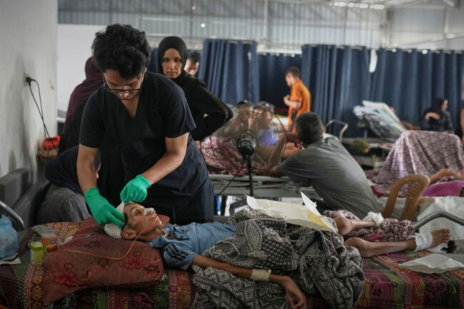dr-jamal-salha-tends-to-a-young-patient-at-shifa-hospital-in-gaza-city-july-7-2025-ap-photojehad-alshrafi
