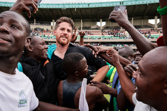 nairobi-kenya-25-jun-2023-johnathan-mckinstry-head-coach-gor-mahia-is-surrounded-and-lifted-as-he-tries-to-make-it-to-the-presentation-enclosure-as-fans-invade-the-pitch-in-celebration-after-th