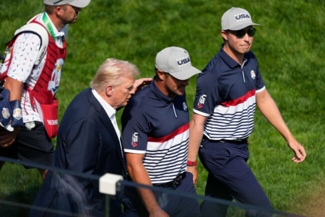 president-donald-trump-from-left-walks-with-united-states-bryson-dechambeau-and-ben-griffin-as-trump-attends-the-ryder-cup-golf-tournament-friday-sept-26-2025-on-the-bethpage-black-golf-course