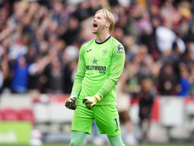 brentford-goalkeeper-caoimhin-kelleher-celebrates-mathias-jensen-scoring-their-third-goal-during-the-premier-league-match-at-the-gtech-community-stadium-london-picture-date-saturday-september-27-2