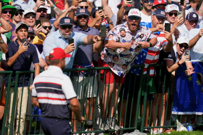 fans-cheer-as-united-states-bryson-dechambeau-walks-on-the-first-hole-during-their-singles-match-on-the-bethpage-black-golf-course-at-the-ryder-cup-golf-tournament-sunday-sept-28-2025-in-farming