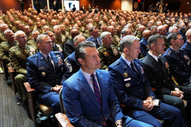defense-secretary-pete-hegseth-center-sitting-with-chairman-of-the-joint-chiefs-of-staff-air-force-gen-dan-caine-third-from-right-and-u-s-military-senior-leadership-as-they-listen-to-president-d