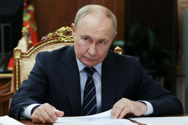 russian-president-vladimir-putin-listens-to-deputy-prime-minister-marat-khusnullin-during-a-meeting-at-the-kremlin-in-moscow-russia-tuesday-sept-30-2025-alexander-kazakov-sputnik-kremlin-pool