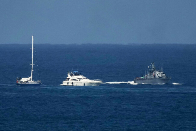 an-israeli-navy-vessel-escort-boats-from-the-civilian-gaza-bound-flotilla-sumud-after-they-were-intercepted-approaching-the-gaza-coast-toward-the-port-of-ashdod-israel-thursday-oct-2-2025-ap-ph