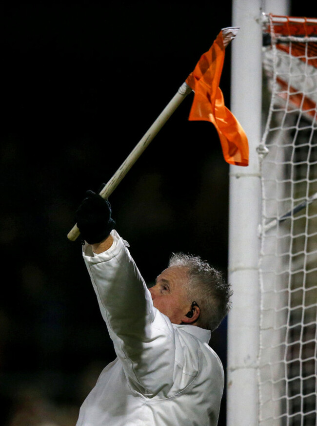 a-view-of-an-umpire-signalling-for-a-2-point-score