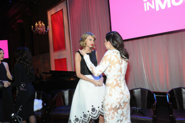taylor-swift-left-and-charli-xcx-seen-at-billboard-women-in-music-at-cipriani-wall-street-on-friday-dec-12-2014-in-new-york-photo-by-diane-bondareffinvision-for-billboard-magazineap-images