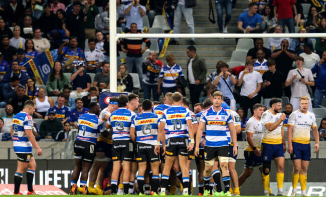 stefan-ungerer-celebrates-scoring-their-first-try-with-teammates-as-ciaran-frawley-and-robbie-henshaw-look-on-dejected