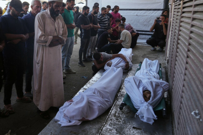 mourners-pray-over-the-bodies-of-palestinians-killed-by-israeli-army-shelling-during-their-funeral-outside-al-aqsa-hospital-in-deir-al-balah-central-gaza-strip-saturday-oct-4-2025-ap-photoabd