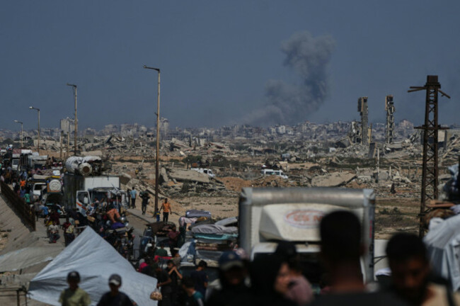 smoke-billows-over-gaza-city-following-an-israeli-airstrike-as-displaced-palestinians-flee-northern-gaza-through-wadi-gaza-wednesday-sept-24-2025-ap-photoabdel-kareem-hana