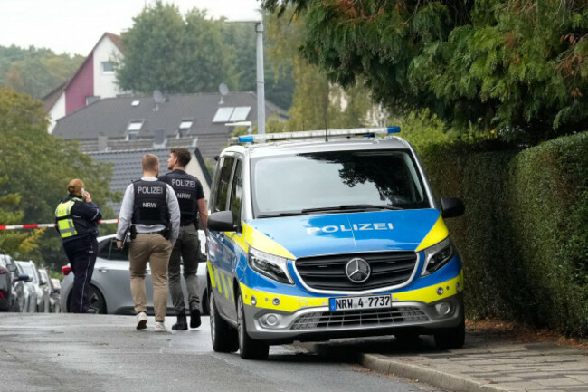 police-officers-across-a-street-in-herdecke-germany-tuesday-oct-7-2025-after-the-newly-elected-mayor-of-herdecke-iris-stalzer-has-been-found-critically-injured-in-her-apartment-ap-photomart