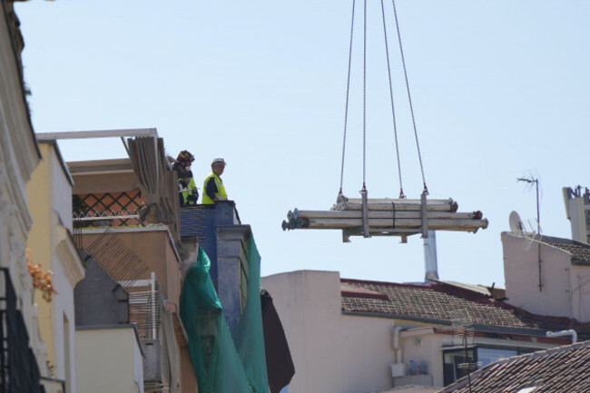 rescue-workers-stand-on-the-roof-at-the-scene-of-a-building-collapse-in-madrid-spain-on-tuesday-oct-7-2025-ap-photomanu-fernandez