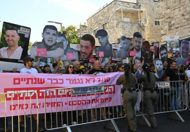 jerusalem-israel-07th-oct-2025-families-and-supporters-of-israeli-hostages-carry-cut-out-portraits-of-those-held-by-hamas-in-gaza-during-a-protest-demanding-a-ceasefire-deal-near-israeli-prime-min