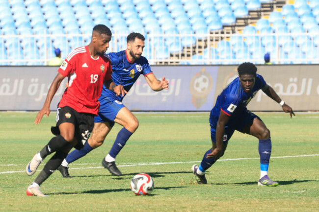 cape-verdes-roberto-lopes-rear-center-and-joao-paulo-fernandes-right-fight-for-the-ball-with-libyas-muad-eisay-left-during-the-world-cup-2026-african-qualifier-group-d-soccer-match-between-lib