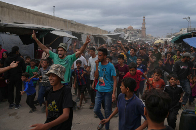 palestinians-celebrate-following-the-announcement-that-israel-and-hamas-have-agreed-to-the-first-phase-of-a-peace-plan-to-pause-the-fighting-in-khan-younis-southern-gaza-strip-thursday-oct-9-202