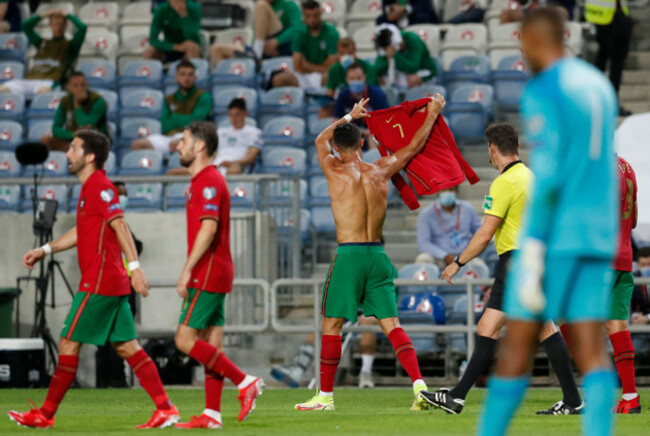 portugals-cristiano-ronaldo-holds-up-his-shirt-as-he-celebrates-after-scoring-his-sides-second-goal-during-the-world-cup-2022-group-a-qualifying-soccer-match-between-portugal-and-the-republic-of-ire