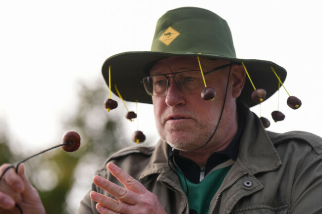 a-competitor-wearing-a-conker-themed-hat-takes-part-in-the-annual-world-conker-championships-at-the-shuckburgh-arms-in-southwick-peterborough-picture-date-sunday-october-13-2024