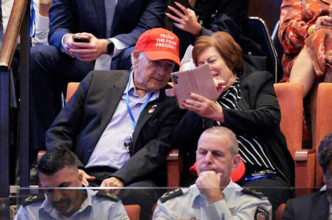 people-wearing-hats-that-read-trump-the-peace-president-inside-the-knesset-as-president-donald-trump-prepares-to-deliver-remarks-monday-oct-13-2025-in-jerusalem-chip-somodevillapool-via-ap