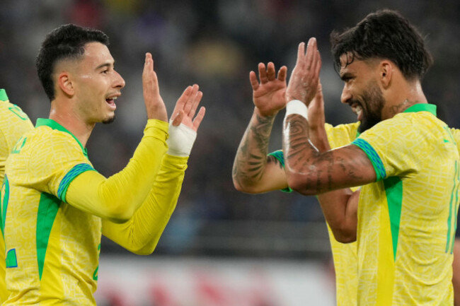 brazils-gabriel-martinelli-left-celebrates-after-scoring-a-goal-during-the-friendly-soccer-match-between-japan-and-brazil-tuesday-oct-14-2025-in-tokyo-ap-photoeugene-hoshiko