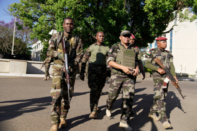 capsat-military-unit-commander-col-michael-randrianirina-center-arrives-at-the-presidency-to-announce-that-the-armed-forces-are-taking-control-of-the-country-in-antananarivo-madagascar-tuesday-o