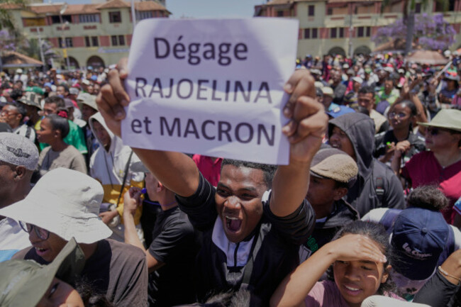 a-protester-displays-a-placard-during-a-protest-calling-for-president-andry-rajoelina-to-step-down-in-antananarivo-madagascar-tuesday-oct-14-2025-ap-photobrian-inganga