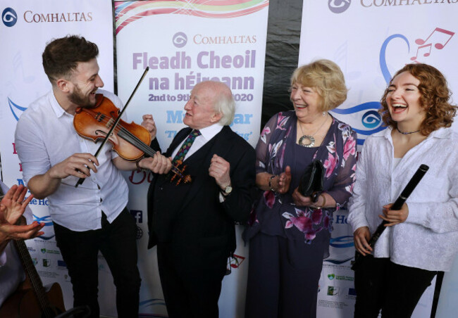 president-michael-d-higgins-and-his-wife-sabina-second-right-with-musicians-daniel-boland-and-niamh-glynn-right-from-ballymore-comhaltas-at-the-official-opening-of-the-fleadh-cheoil-na-heireann