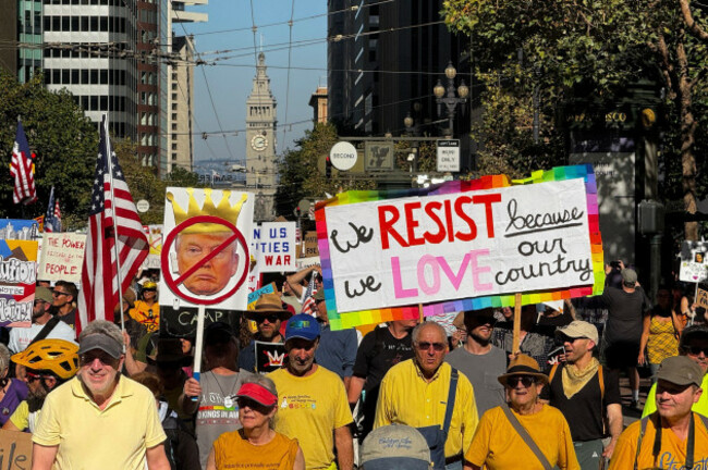 protesters-march-through-downtown-san-francisco-as-part-of-the-nationwide-no-kings-demonstrations-on-saturday-oct-18-2025-ap-phototerry-chea