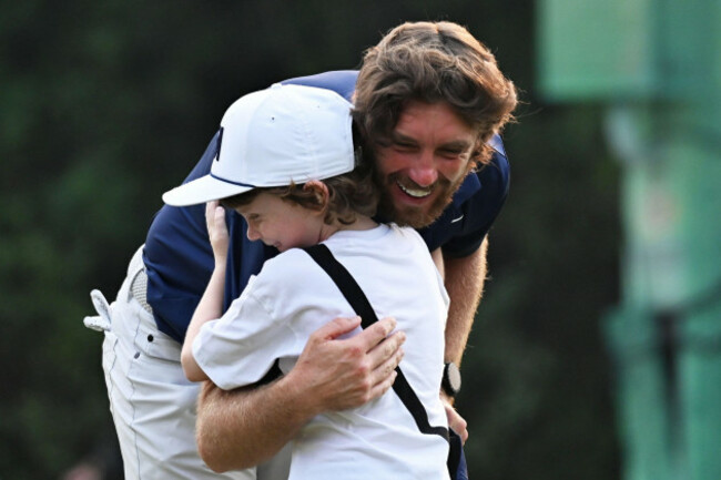 tommy-fleetwood-of-england-hugs-his-son-frankie-after-wining-the-dp-world-tour-championship-golf-tournament-in-new-delhi-india-sunday-oct-19-2025-ap-photodharam-diwakar