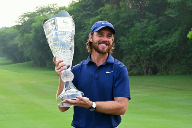 tommy-fleetwood-of-england-poses-with-the-trophy-after-wining-the-dp-world-tour-championship-golf-tournament-in-new-delhi-india-sunday-oct-19-2025-ap-photodharam-diwakar
