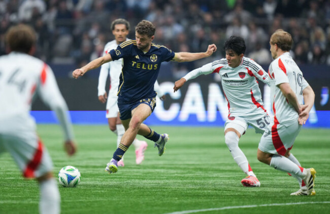 vancouver-whitecaps-thomas-muller-left-takes-a-shot-on-goal-as-fc-dallas-diego-garcia-back-right-defends-during-the-second-half-of-an-mls-soccer-match-in-vancouver-on-saturday-oct-18-2025