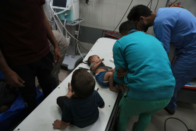 wounded-palestinian-infants-are-brought-to-nasser-hospital-after-an-israeli-army-bombardment-in-khan-younis-gaza-strip-sunday-oct-19-2025-ap-photojehad-alshrafi
