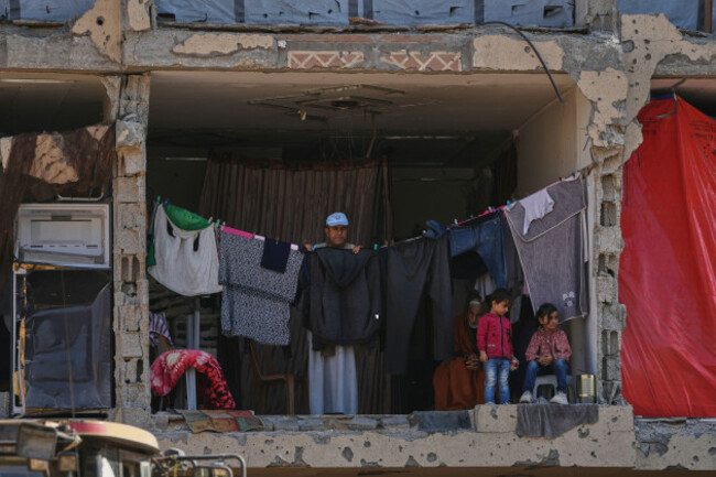 palestinians-watch-members-of-the-hamas-militant-group-searching-for-bodies-of-the-israeli-hostages-in-khan-younis-southern-gaza-strip-sunday-oct-19-2025-ap-photoabdel-kareem-hana