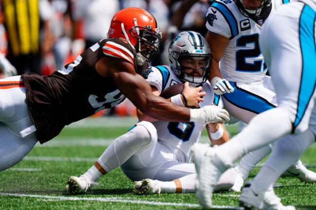 carolina-panthers-quarterback-baker-mayfield-is-tackled-by-cleveland-browns-defensive-end-myles-garrett-after-recovering-his-own-fumble-during-the-first-quarter-of-an-nfl-football-game-on-sunday-sept
